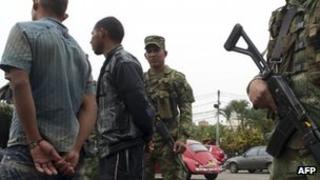 Demobilized Farc fighters escorted by troops, September 2012