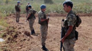 Turkish commandos stand near the Turkey-Syria border in Akcakale, Turkey, 4 October 2012