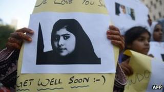 Pakistani demonstrators carry photographs of gunshot victim and child activist Malala Yousafzai. File pic: 11/10/2012