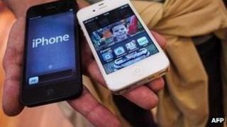 Customer holding iPhone5