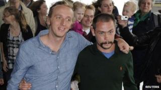 Swedish reporter Martin Schibbye and photographer Johan Persson (R) arrive at Arlanda airport in Stockholm September 14, 2012.