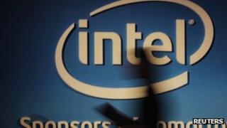 Woman's shadow on Intel sign