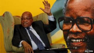 South African President Jacob Zuma sitting in front of a portrait of late African National Congress (ANC) President Oliver Reginald Tambo, during a briefing with the South African Foreign Correspondents Association in Johannesburg - 29 October 2012