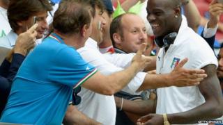 Mario Balotelli of Italy signs autographs for fans ahead of the Uefa Euro 2012 semi final match between Germany and Italy at National Stadium on 28 June 2012 in Warsaw, Poland