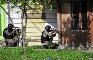 Indonesian anti-terror police take aim in Poso, Central Sulawesi province, 3 November