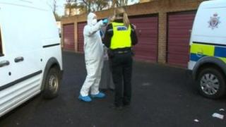 Forensic experts and police near to where the man was found in Washington.