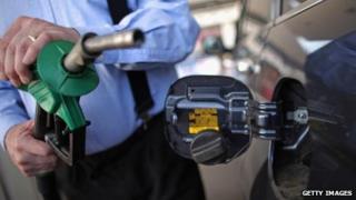 A driver filling up his car with petrol