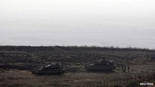 File pic: Israeli tanks are seen close to the ceasefire line between Israel and Syria, near Alonei Habashan in the Israeli-occupied Golan Heights, 7 November 2012
