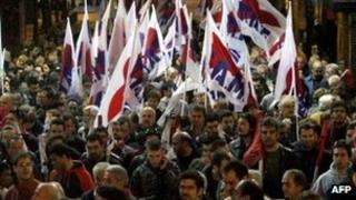 Demonstrators protest against austerity measures in Athens on Sunday