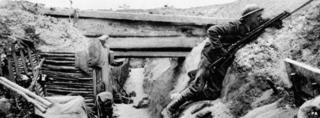 British soldier watching No-Man's land at Oviller during the Battle of the Somme in 1916