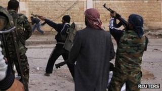 Free Syrian Army fighters firing weapons