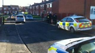 Police cars and cordon on a residential street
