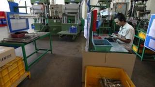 Worker in a rubber factory
