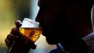 Man drinks pint of lager