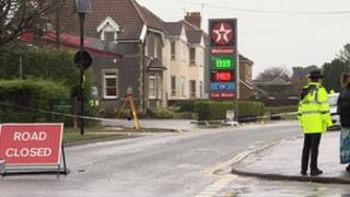 Police near the Texaco garage where a man was knocked down in a hit-and-run