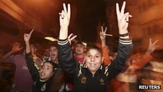 Palestinian boys celebrate the ceasefire, Gaza City (21 Nov)