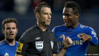 Referee Mark Clattenburg and Chelsea's John Mikel Obi