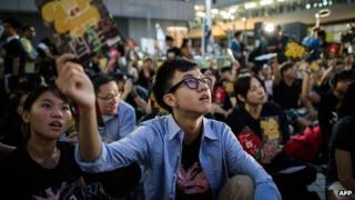 A student holds a leaflet during a protest asking for the complete withdrawal of the government's plans to implement Chinese patriotism classes in Hong Kong on October 17, 2012.