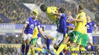 Sebastien Bassong heading the ball