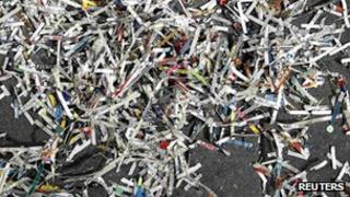 Garbage and confetti lie on the ground after the Macy's Thanksgiving Day Parade in New York on 22 November 2012