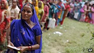 nemployed educated Indian women stand in a queue to register themselves at the Employment Exchange Office in Allahabad, India.