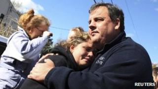 Chris Christie embraces a New Jersey woman after Sandy (3 Nov)