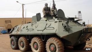 Islamists on an abandoned tank in northern Mali, August 2012