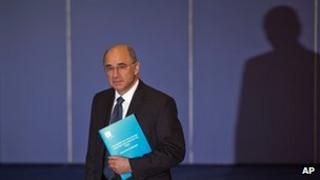 Lord Justice Leveson holds a summary of his report