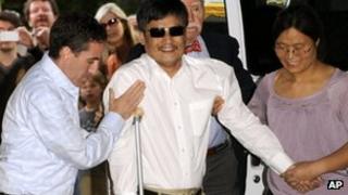 In this May 19, 2012 file photo, blind Chinese legal activist Chen Guangcheng arrives at Washington Square Village on the campus of New York University, in New York