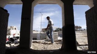 A labourer in the West Bank Jewish settlement of Maale Adumim, near Jerusalem, 2 December, 2012.