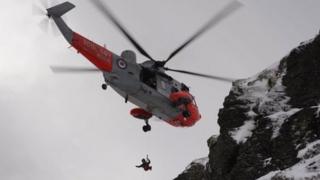 Winchman descending during the rescue
