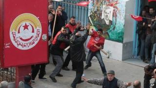 Members of the UGTT union clash with pro-government supporters