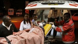 Paramedics treat a wounded person after a blast in Kenya's capital Nairobi on 5 December 2012