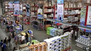 Indian people shop at a Bharti-Walmart store on the outskirts of Chandigarh, India, Wednesday, Dec. 5, 2012. I