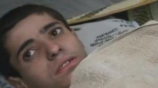 A video posted online by opposition activists purported to show a young Alawite boy who survived the events in Aqrab