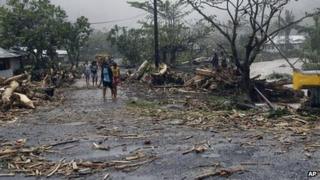 People walk through debris in Samoa's capital Apia. Photo: 14 December 2012
