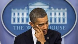 President Obama wipes away a tear while he talks about the Sandy Hook School shooting