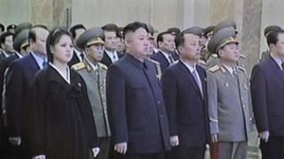 Screen grab from North Korean television shows Kim Jong-un and his wife at the memorial palace on 17 December 2012