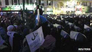 Demonstrators protest in front of Cairo's Supreme Judicial House ahead of the resignation