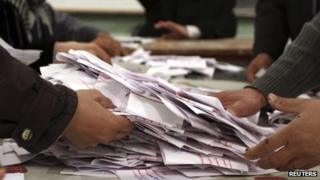 Officials count ballots after polls closed during the final stage of a referendum on Egypt"s new constitution (22 December 2012)