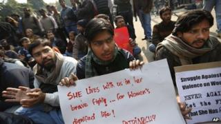 People gather to mourn the death of the 23-year-old gang rape victim, in New Delhi, India