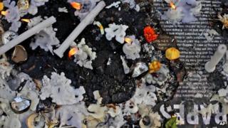 Candles stand lit at a makeshift memorial for a gang-rape victim in New Delhi, India