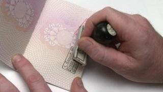 A passport being stamped