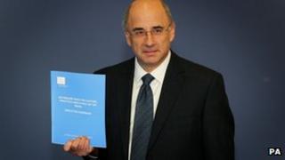 Lord Justice Leveson with his report
