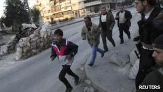 Residents run for cover in Aleppo