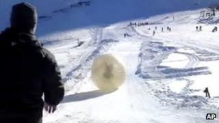 Denis Burakov and another man are seen inside a zorb in Dombai. Photo: 3 January 2013