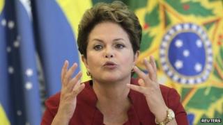 Dilma Rousseff speaks with reporters on 27 December 2012