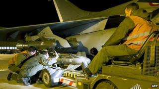 French soldiers equipping a French Rafale fighter with A2SM ammunitions before its departure for a base in Chad