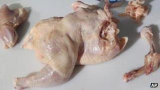 Raw chicken is prepared for food
