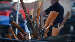 Guns in a trash can